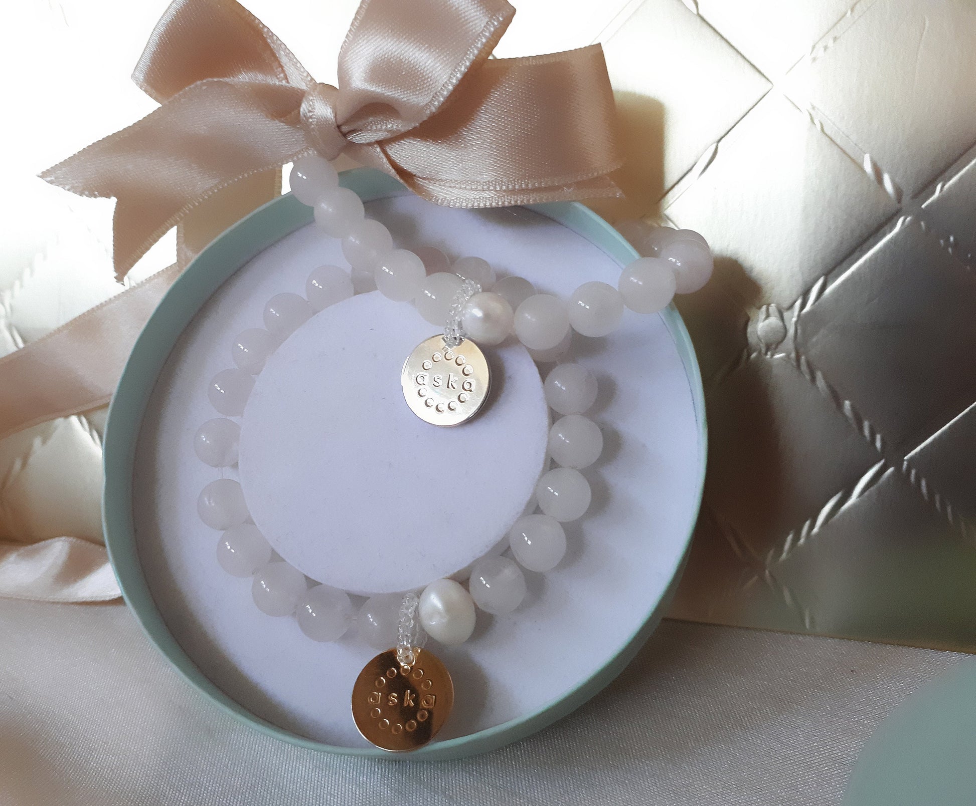 Aska Maternity Movement Bracelet in rose quartz with sterling silver pendant